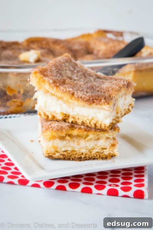 Cinnamon Sugar Sopapilla Cheesecake Bars 2 A piece of cake on a plate, with Cheesecake and Butter