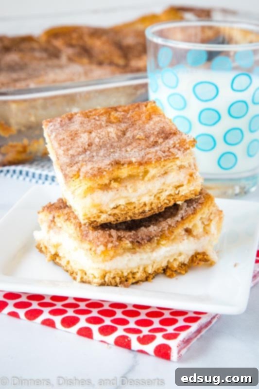 Cinnamon Sugar Sopapilla Cheesecake Bars 3 A close up of a slice of cake on a plate, with Dinner and Cheesecake