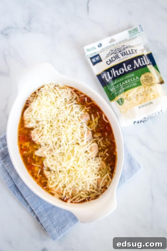 Sprinkle the cheese over the cooked chicken 