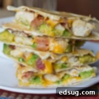 Quesadillas are a very versatile easy dinner to get on the table. This version is filled with crispy bacon, chicken, and buttery avocado. Great for busy school nights.