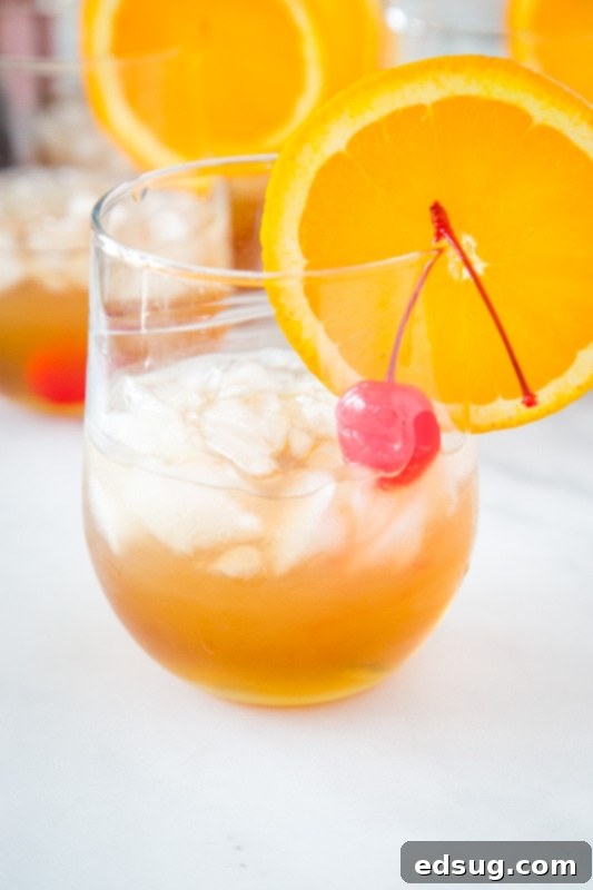 Classic Amaretto Sour Recipe 2 Classic amaretto sour is super simple to make with just 4 ingredients. A beautiful golden-amber drink with an orange slice and cherry garnish, inviting home mixologists.