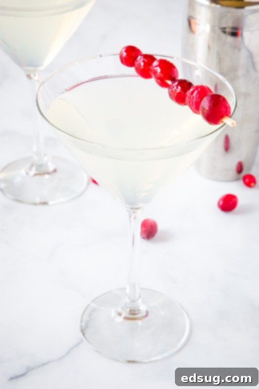 Preparing ingredients for a Winter White Cosmo, including fresh lime, vodka, and white cranberry juice, showing its ease of assembly for any winter gathering.
