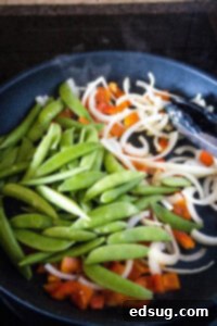 Fiery Chicken Stir Fry 10 stir fry veggies in a pan