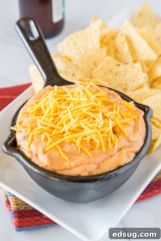 Effortless Refried Bean Dip 2 Super creamy and cheesy refried bean dip, perfect for parties and taco nights, served with tortilla chips.