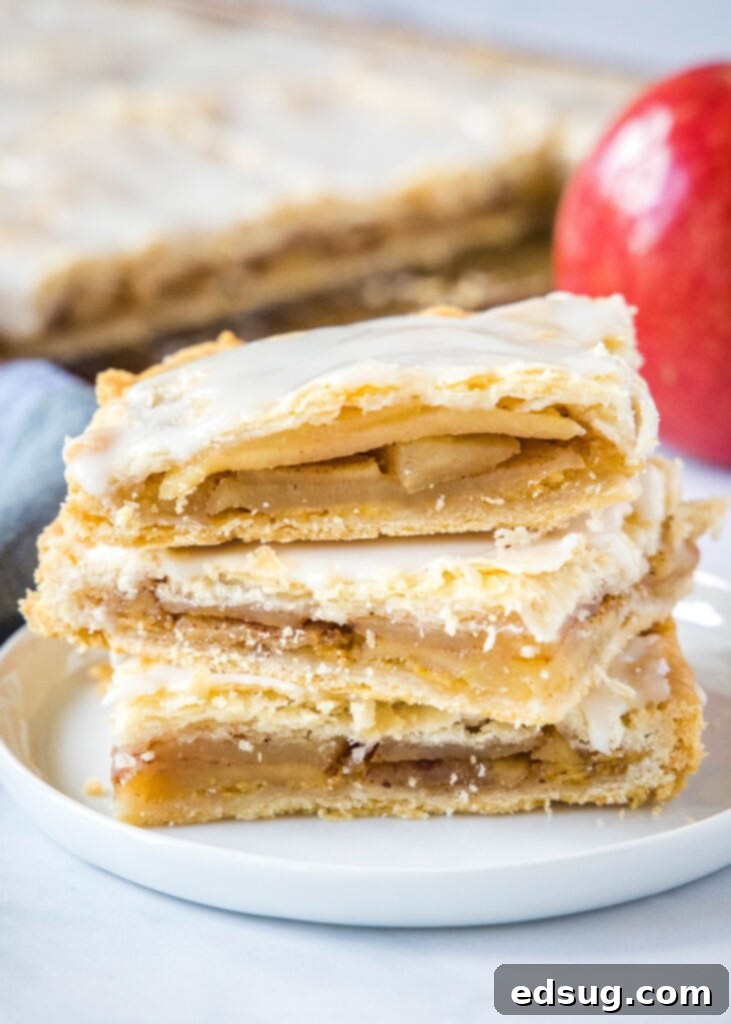 Apple Crumble Bars 2 apple bars stacked on a white plate