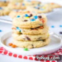 close up of cookies stacked on a white plate