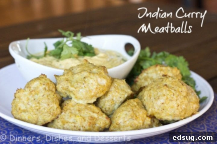 Meatball Masala 2 Plate of golden-brown Indian curry meatballs, garnished with fresh cilantro