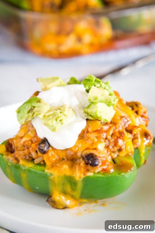 Easy taco stuffed peppers that will be on repeat for taco night, filled with flavorful ingredients.
