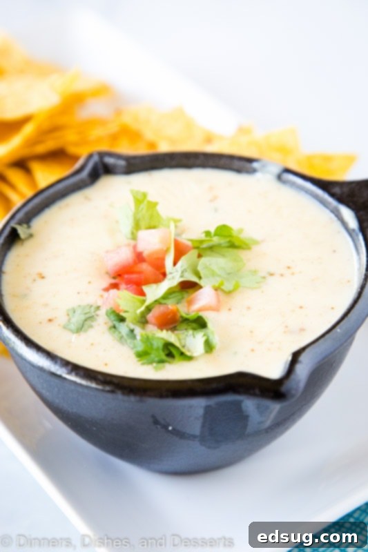 Homemade White Mexican Queso Dip is incredibly easy to make, ideal for taco night or your next party.
