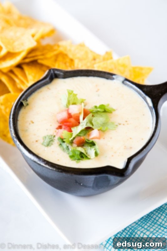 White Queso dip in a serving bowl, just like your favorite Mexican restaurant.