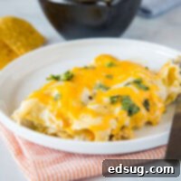 White Chicken Enchiladas - super easy sour cream chicken enchiladas that are made with lots of creamy and tangy sour cream for a delicious white sauce. They are cheesy, full of flavor and great for dinner anytime!