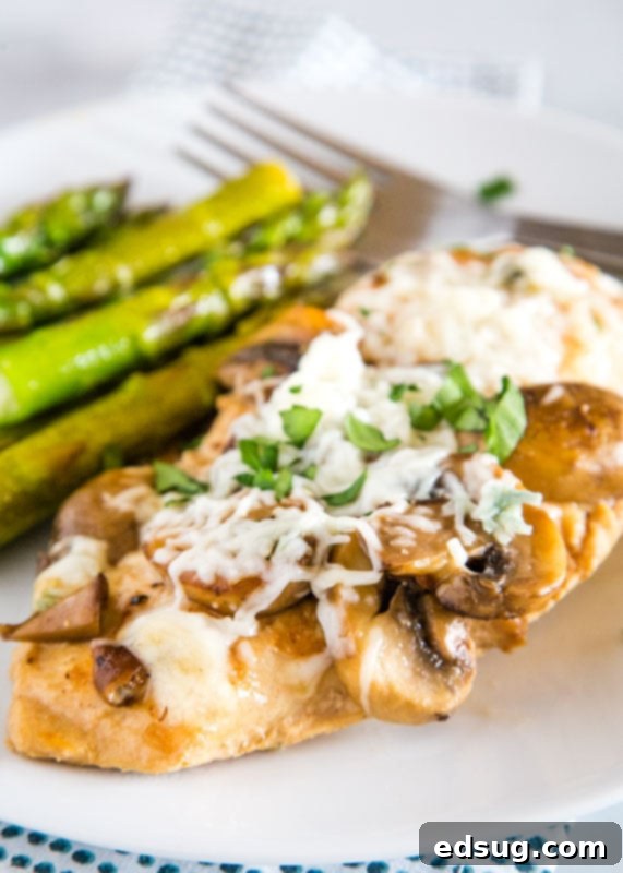 Chicken in a mushroom madeira sauce and topped with melted cheese