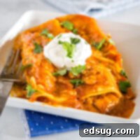 Easy Ground Beef Enchiladas - easy enchiladas filled with seasoned ground beef, onions, and lots of cheese! Absolutely delicious with just a few simple ingredients. Get a restaurant quality dinner on the table for dinner tonight! 