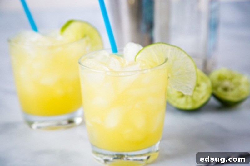 Pineapple Margarita - a fun twist on the classic margarita. The sweet pineapple makes it extra tasty. Just 4 ingredients to make this easy and delicious cocktail. 