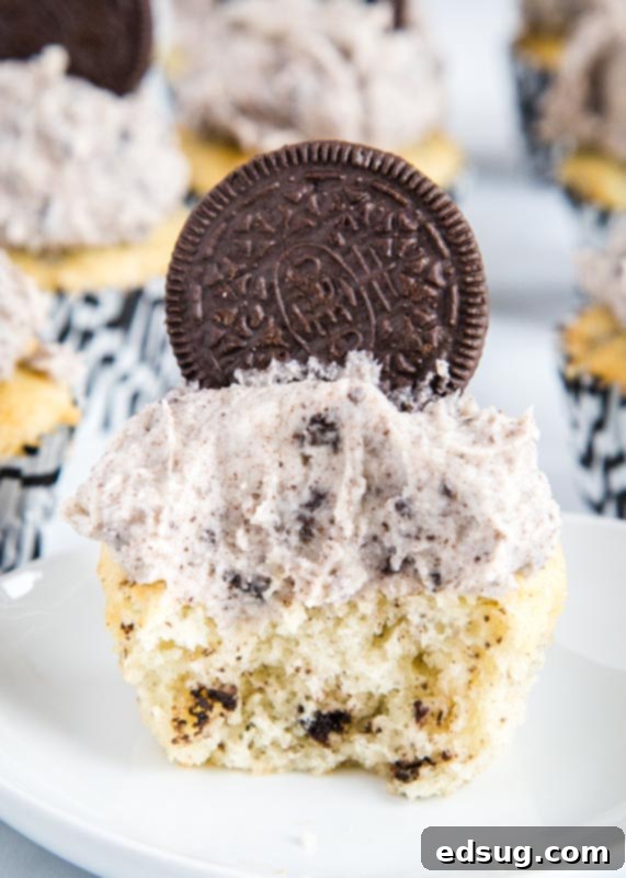 Oreo Delight Cupcakes 3 Moist vanilla cupcakes with a rich, creamy Oreo buttercream frosting, garnished with cookie crumbs.