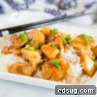 General Tso's Crispy Classic 6 A small, appetizing bowl of General Tso Chicken, featuring tender chicken pieces in a vibrant sauce, ideal for a quick and healthy dinner.