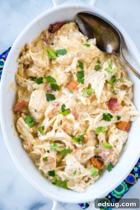 Irresistible Instant Pot Crack Chicken 5 Shredded chicken with cream cheese, ranch mix, bacon, and cheddar cheese