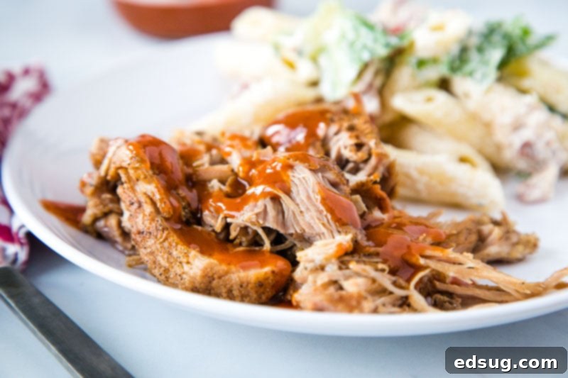 Fall-Off-The-Bone Instant Pot Country Ribs 5 Plated Instant Pot Country Style Ribs topped with barbecue sauce and fresh parsley