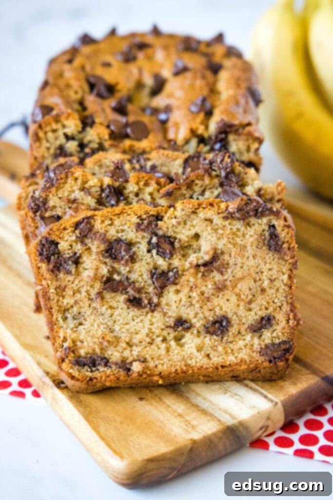 Ultimate Peanut Butter Banana Bread 2 sliced peanut butter banana bread on cutting board