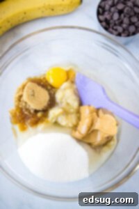 Ultimate Peanut Butter Banana Bread 7 mixing wet ingredients for banana bread