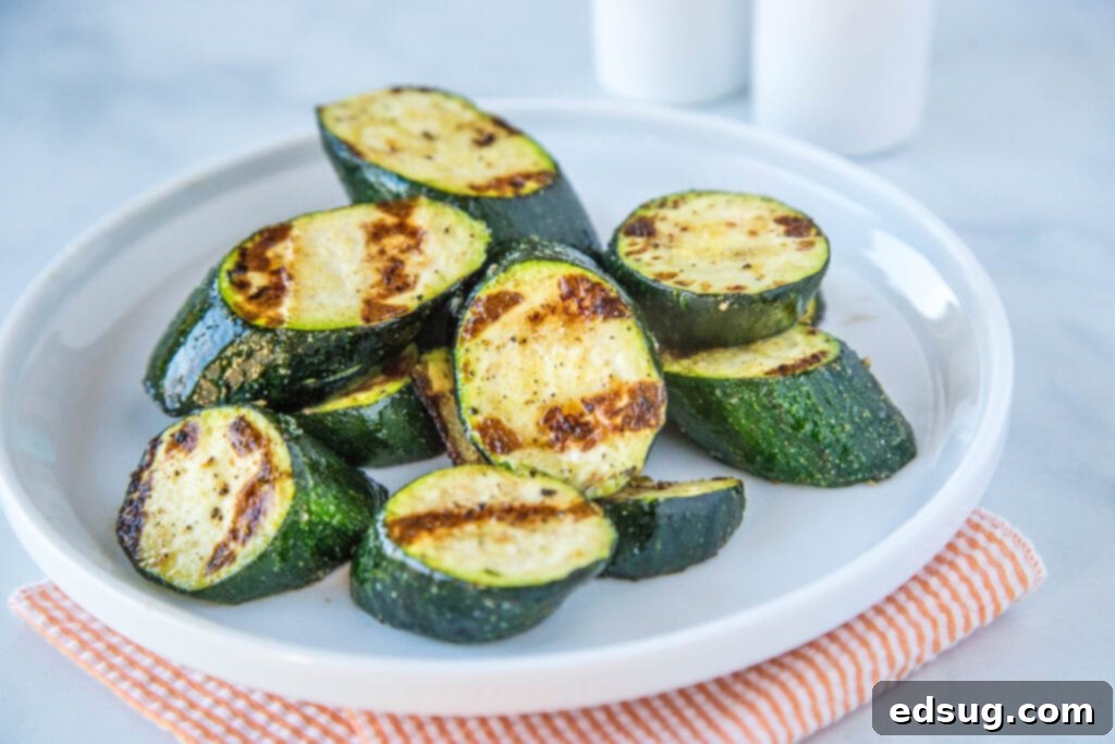 Grilled Zucchini - throw zucchini on the grill for a quick and easy side dish.  It is ready in just minutes, is deliciously healthy and perfect with just about any summer meal!