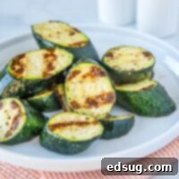 Grilled Zucchini - throw zucchini on the grill for a quick and easy side dish.  It is ready in just minutes, is deliciously healthy and perfect with just about any summer meal!