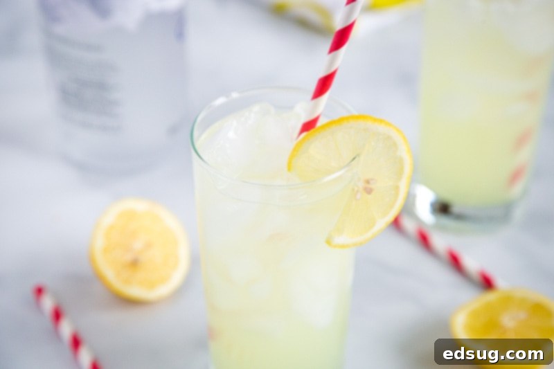 Refreshing Vodka Lemonade 5 A large pitcher of homemade Vodka Lemonade with lemon slices and ice, ready for serving