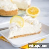 A slice of creamy No-Bake Lemon Cheesecake on a plate.