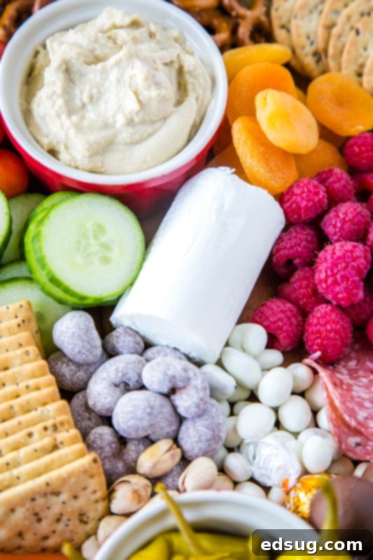 goat cheese, cucumbers, chocolate on snack board