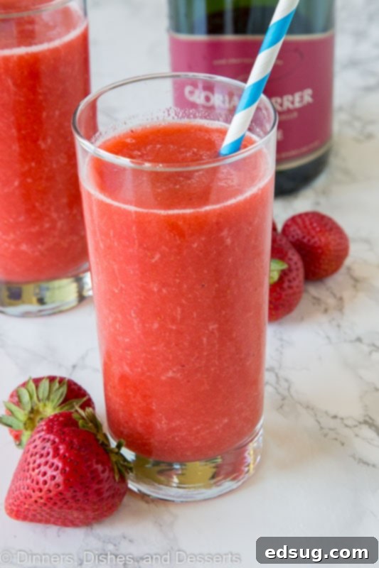 Easy Homemade Frose 2 strawberry frose in a glass with straw