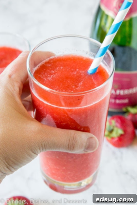 Easy Homemade Frose 3 frozen strawberries and rose wine make a great wine slushie