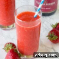 Frosé - A frozen rosé wine slushie with strawberries. A super simple idea that is refreshing and delicious all summer long!