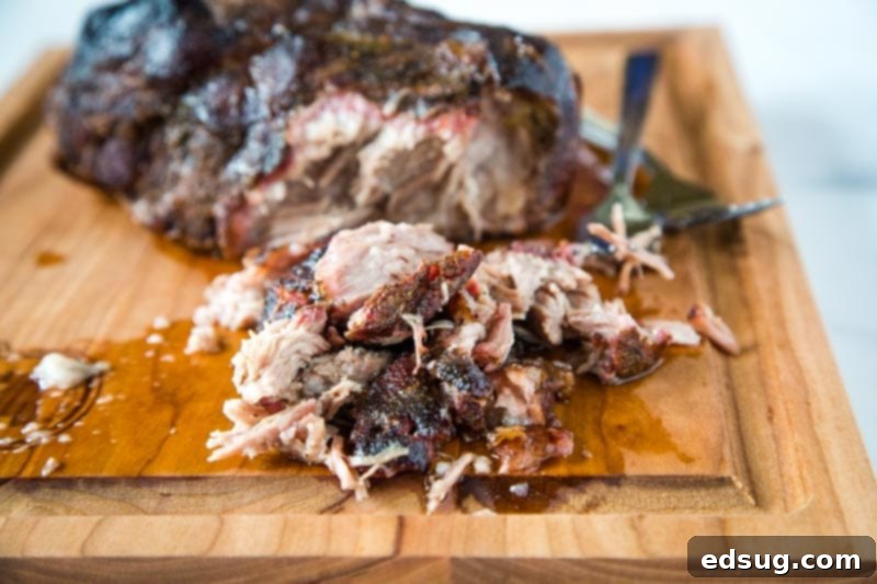 Smoked Pork Butt - A super simple recipe with just a few ingredients for the most tender, juicy, and delicious pulled pork!  Add your favorite sauce or just dive in!  