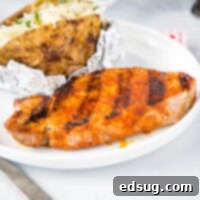 Sizzling Pork Chops 7 Grilled Pork Chops - super easy pork chops that are seasoned with a few simple spices and then grilled to perfection. Juicy, tender, and the perfect easy summer dinner.