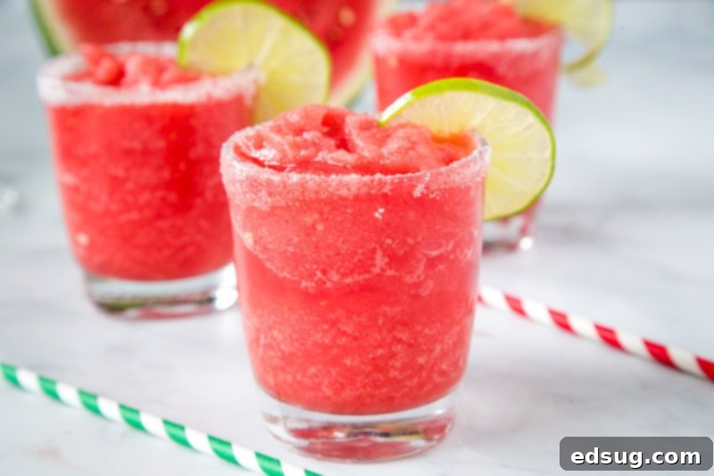 Fresh Watermelon Margaritas 4 A close-up shot of a beautifully presented Watermelon Margarita, showcasing its vibrant color and refreshing appeal.