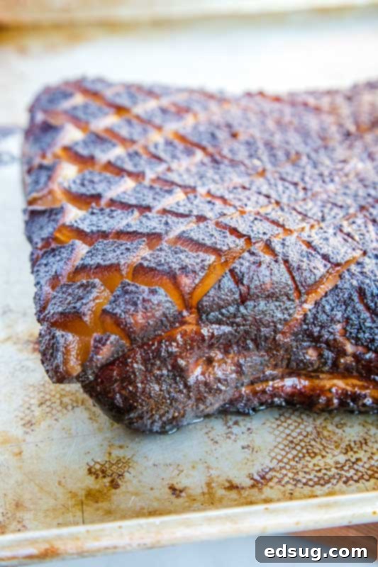 Smokehouse Pork Belly 4 Whole smoked pork belly resting on a baking sheet after cooking