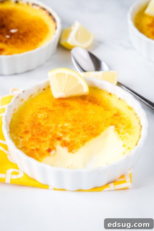 Zesty Lemon Crème Brûlée 3 creme brulee with bite taken out of it
