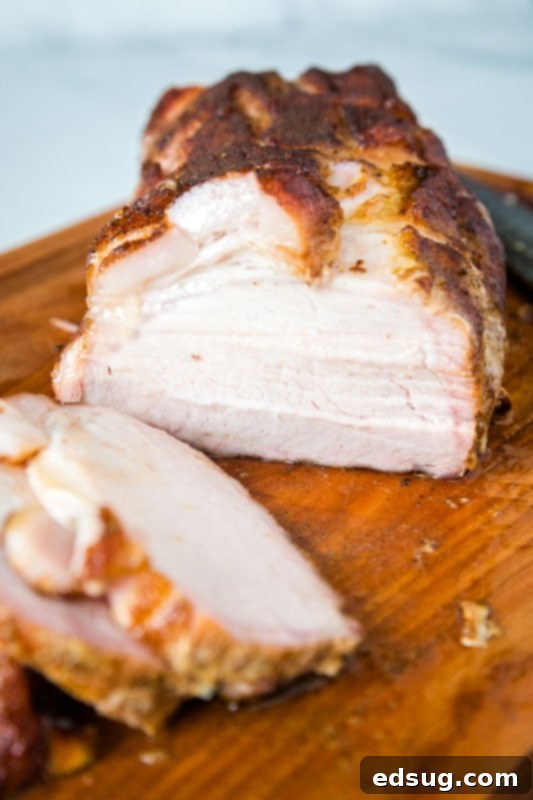 pork loin roast cut in half on cutting board