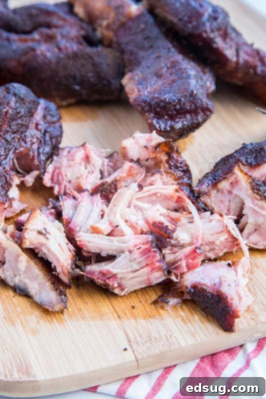 Pulled pork on a cutting board, shredded from country style ribs