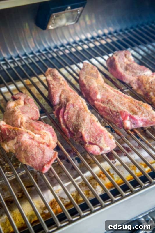 country style ribs smoking on a grill