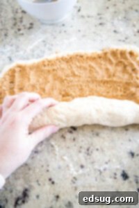 Warm Cinnamon Swirls 11 rolling up dough