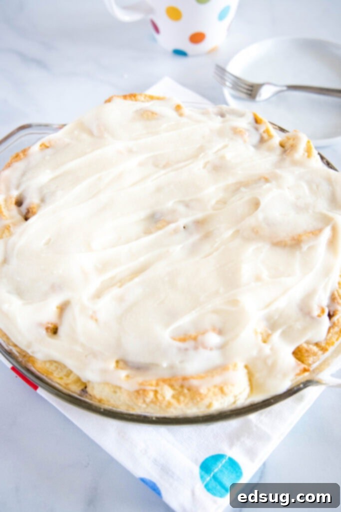 Warm Cinnamon Swirls 3 frosted no yeast cinnamon rolls in a pan