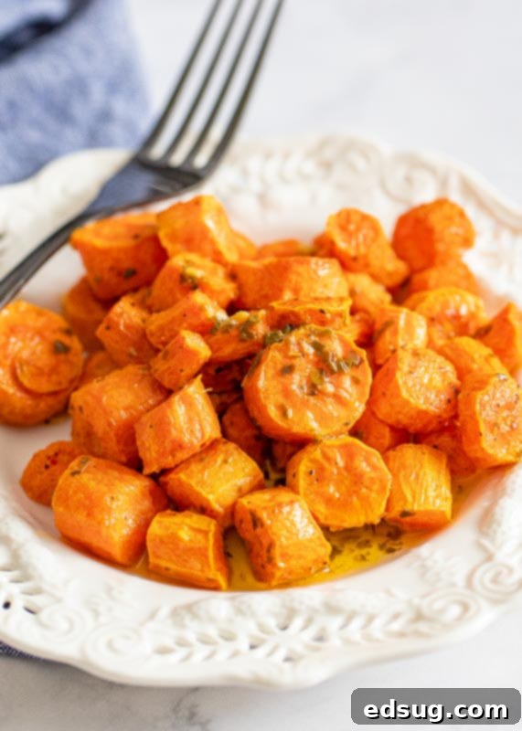 Perfect Air Fryer Carrots 2 air fried carrots on plate with fork