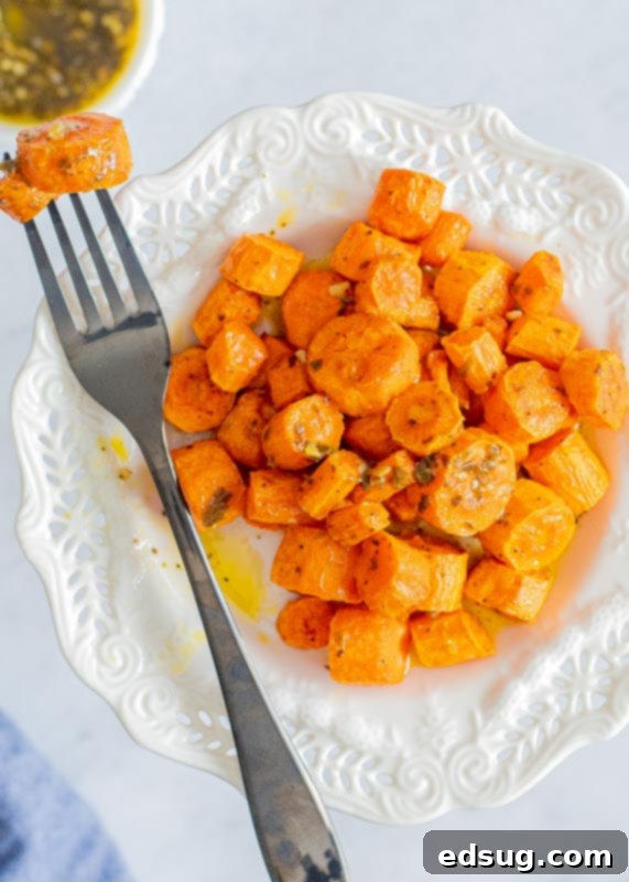 Perfect Air Fryer Carrots 4 roasted carrots on plate with fork
