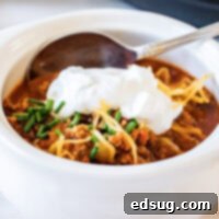 close up of turkey chili in white bowl