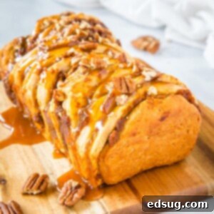 Close up of a slice of Caramel Pecan Pumpkin Pull Apart Bread