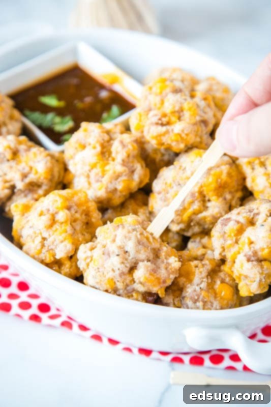 Cream Cheese Sausage Balls 2 meatball being picked up with a toothpic