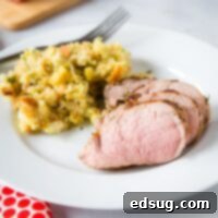 cropped pic of sliced pork tenderloin on plate with stuffing
