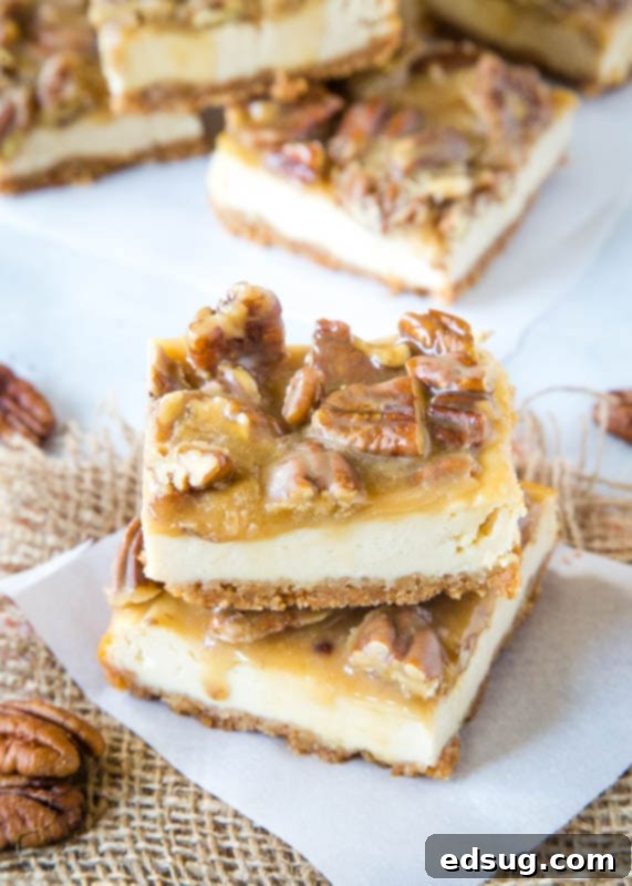 praline cheesecake bars on white paper