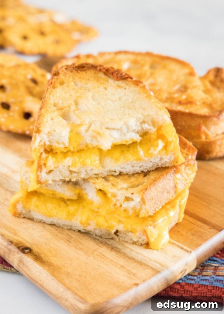 Crispy Air Fryer Grilled Cheese 5 air fryer grilled cheese sandwich on a cutting board